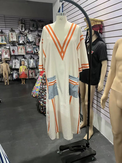 Vestido Maxi Estampado – Escote en V y Bolsillos